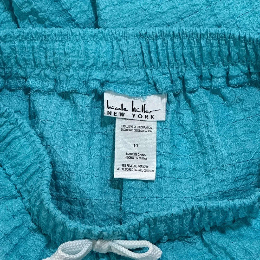 Nicole Miller bright turquoise